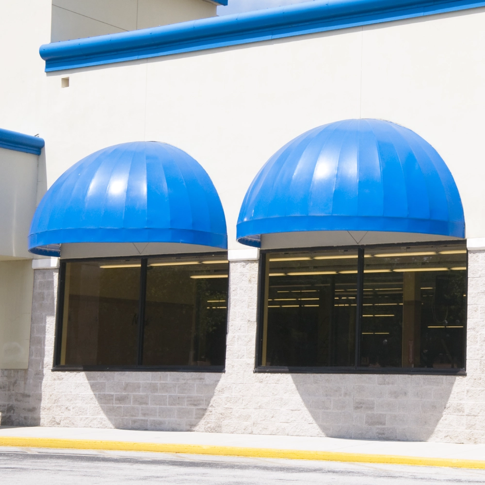 Picture of blue awnings depicting the application of 18oz PVC coated polyester fabric