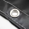 Picture of steel grommet on a black tarp.