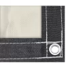 Picture of steel grommet and black webbing on a beige 10x16 18 oz multipurpose tarp