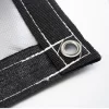 Picture of steel grommet and black webbing on a silver 7x20 18 oz multipurpose tarp.