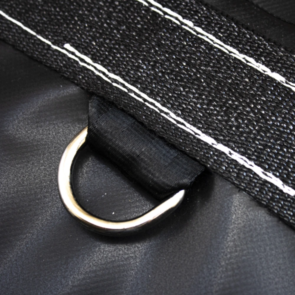 Picture of a D ring sewed under webbing on black tarp.
