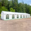 Picture of white tent with windows in front of a forest showing the application of 16oz PVC coated polyester fabric
