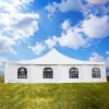 Picture of white tent with windows in the middle of a green field depicting the use of 18oz PVC coated polyester fabric