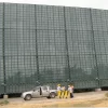 Wind barrier with red webbing depicting the use of 80% Mesh PVC coated polyester